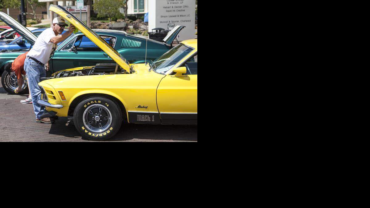 
Tom McCreary of Wichita preps his 1970 Ford Mach I for show at the BlackTop Nationals. (Aug. 22, 2014.) 
