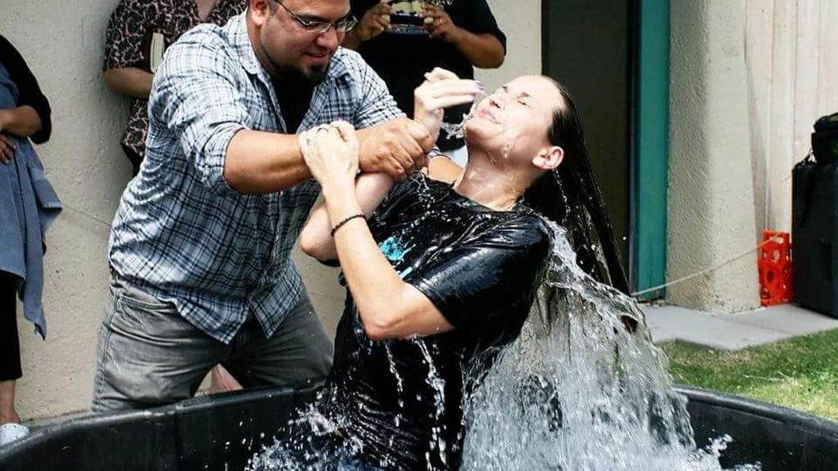 Rachel Bocobo is baptized in a horse trough at The Source Wichita, one of several churches using creative baptisteries.