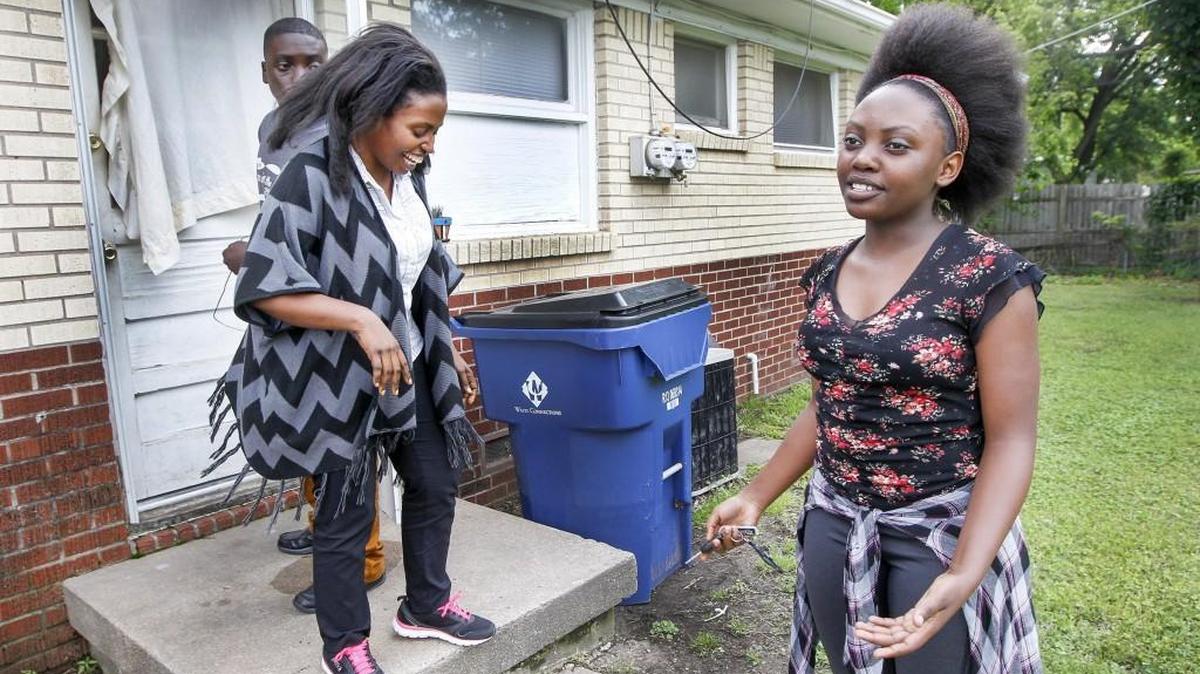 Congo refugee Jolie Uwizeye, left, and her children Debra, 14, and Isaac, 16, get ready to go to a Habitat for Humanity class. (May 17, 2016)