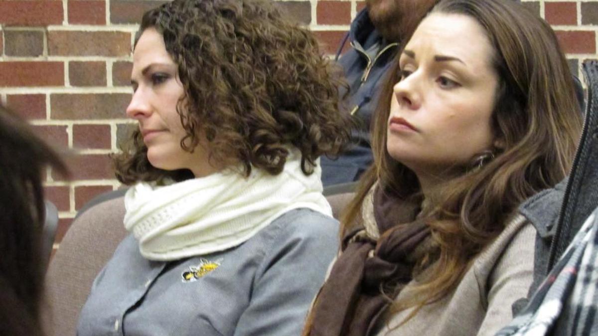 Rebecca Curren and Julie Christensson watch the discussion Friday during a Wichita State University forum on concealed carry. They work with international students and are worried that guns in dorms will make students feel unsafe and discourage freshmen students from wanting to live on campus.