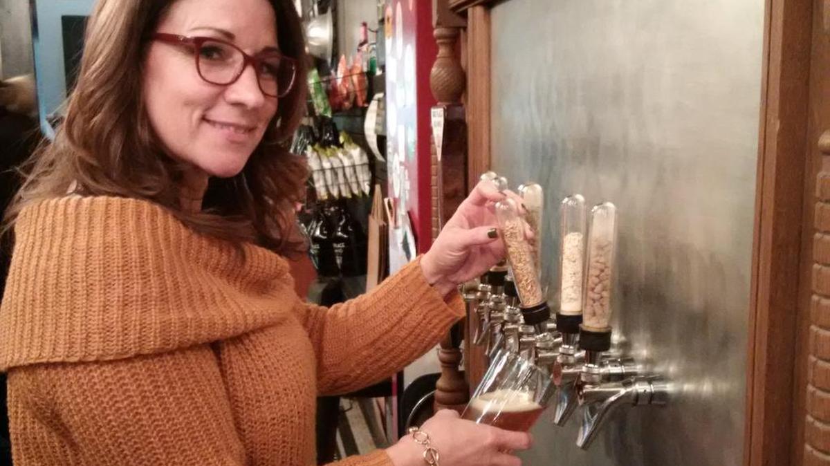 Third Place Brewing taproom manager Dawn Heady expects to sell lots of beer during a four-day watch party around the NCAA basketball tournament next month, including a new peach basket wheat ale dedicated to basketball inventor James Naismith.