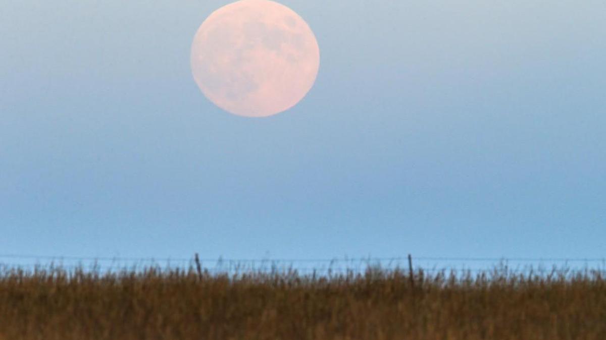 A full moon is seen over the Youngmeyer Ranch in the Flint Hills in 2014.