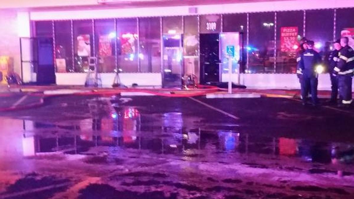 Wichita firefighters clean up after extinguishing a fire at Alberto’s Pizzeria near Seneca and 31st Street South Thursday night. Fire was found in the attic space, with smoke also spreading to Marchello’s Restaurant next door.