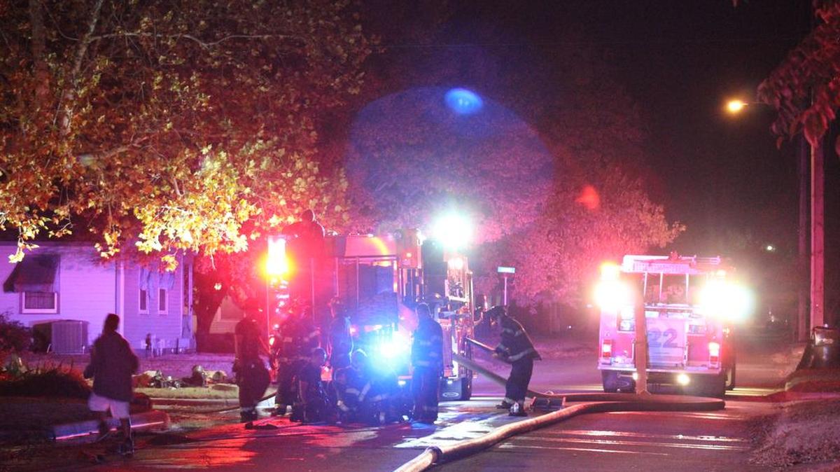 Wichita firefighters respond to the scene of a garage fire in the 1700 block of South Green on Thursday.