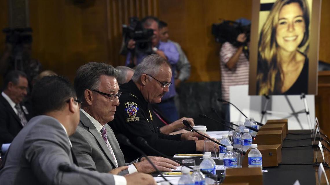 
Jim Steinle, second from left, father of Kathryn Steinle, in photograph, testifies next to Montgomery County (Md.) Police Chief J. Thomas Manger, right, before a Senate Judiciary hearing on July 21 to examine the administration's immigration enforcement policies. Kathryn Steinle was killed on a San Francisco pier, allegedly by a man previously deported several times.
