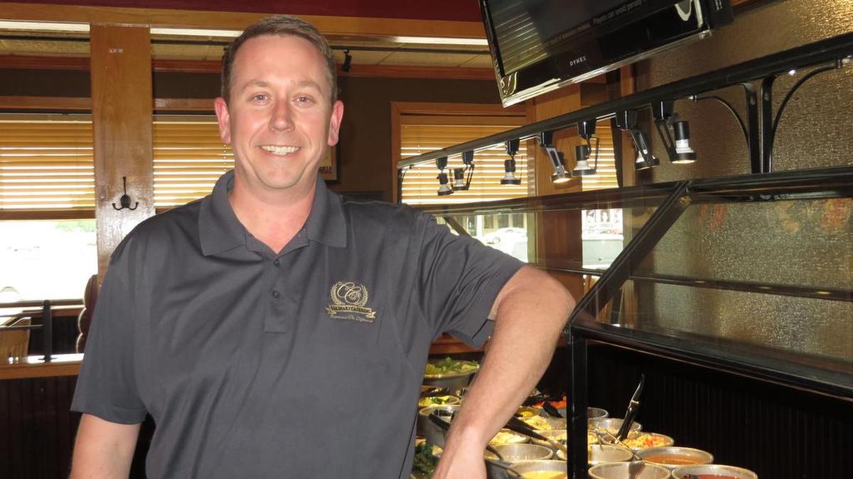Jeremy Barker, shown here at the Two Brothers BBQ restaurant in west Wichita, says he’s excited that his spinoff catering business has won a contract with the city to provide catering at the Century II convention and performing arts center.