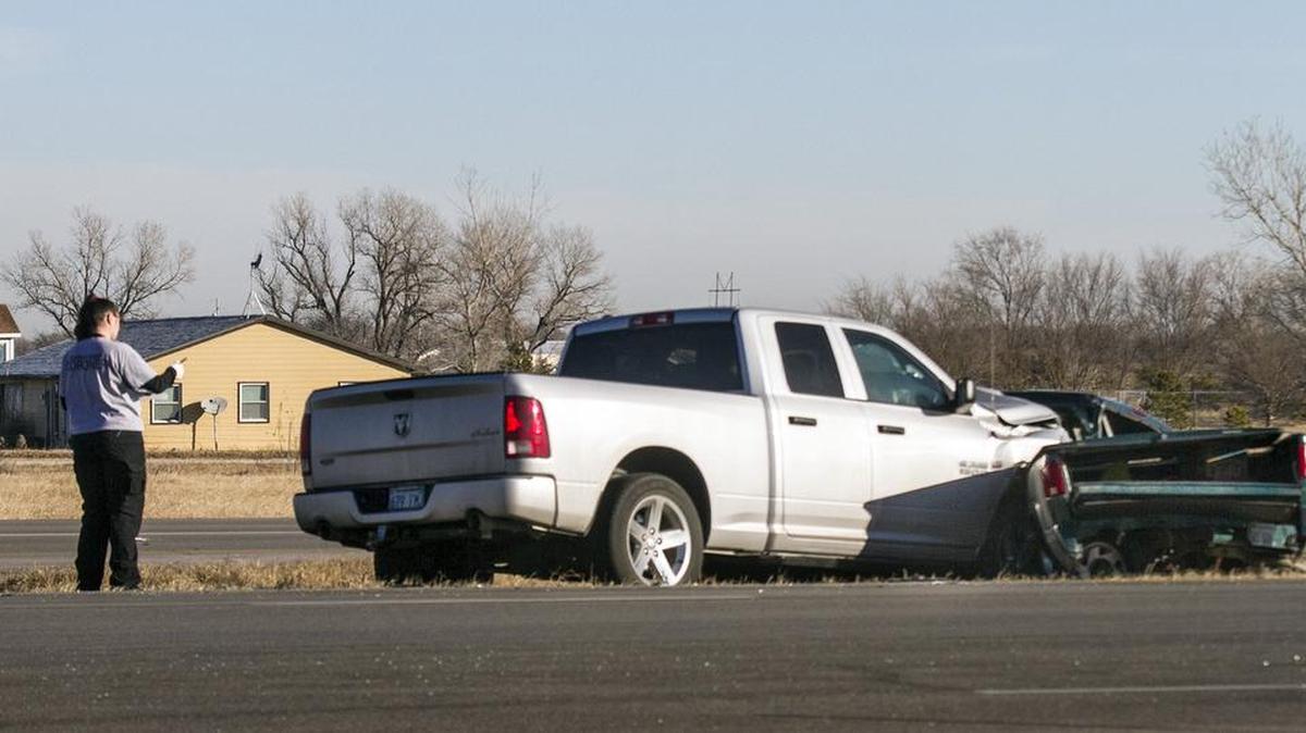 Kansas Highway Patrol and Sedgwick County emergency workers investigate an accident near K-254 and Webb Road. One person died in one of the pickup trucks. (Jan. 27, 2016)