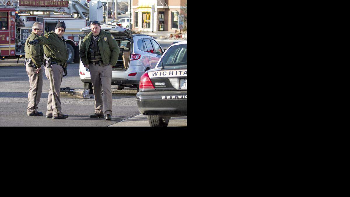 
Wichita police investigate the scene of an accident where a pedestrian was critically injured Thursday morning when she was struck by a vehicle in the parking lot of the Dillons at 21st and Rock Road. (Feb. 5, 2015)
