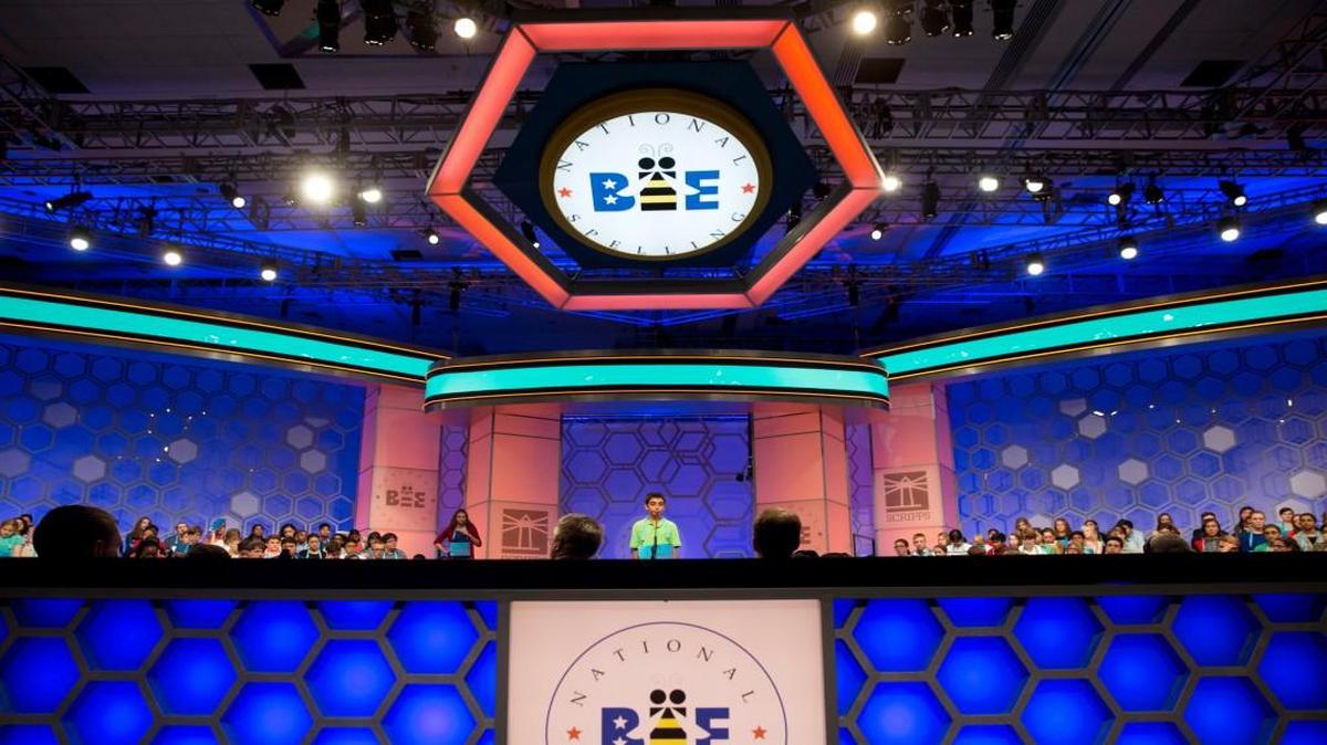 The stage at Holy Cross Lutheran Church will be somewhat less elaborate (and the contestants will be somewhat older) than what is found at the annual Scripps National Spelling Bee, pictured here.
