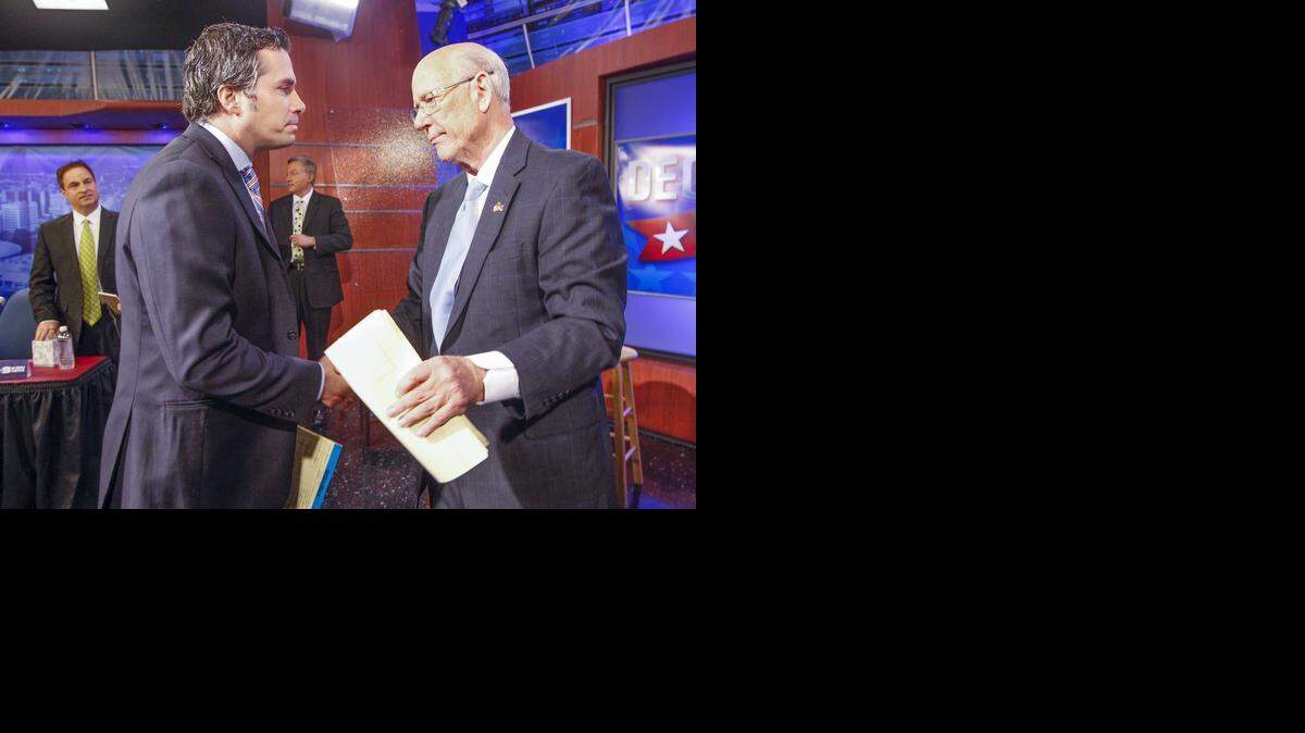 
U.S. Senate independent candidate Greg Orman, left, shakes hands with Sen. Pat Roberts following their debate at the KSN television studio Wednesday in Wichita. (Oct. 15, 2014)
