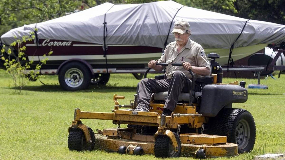 Wayne Townley mows in the North Loop campground in preparation for Memorial Day weekend at Cheney State Park in 2016.
