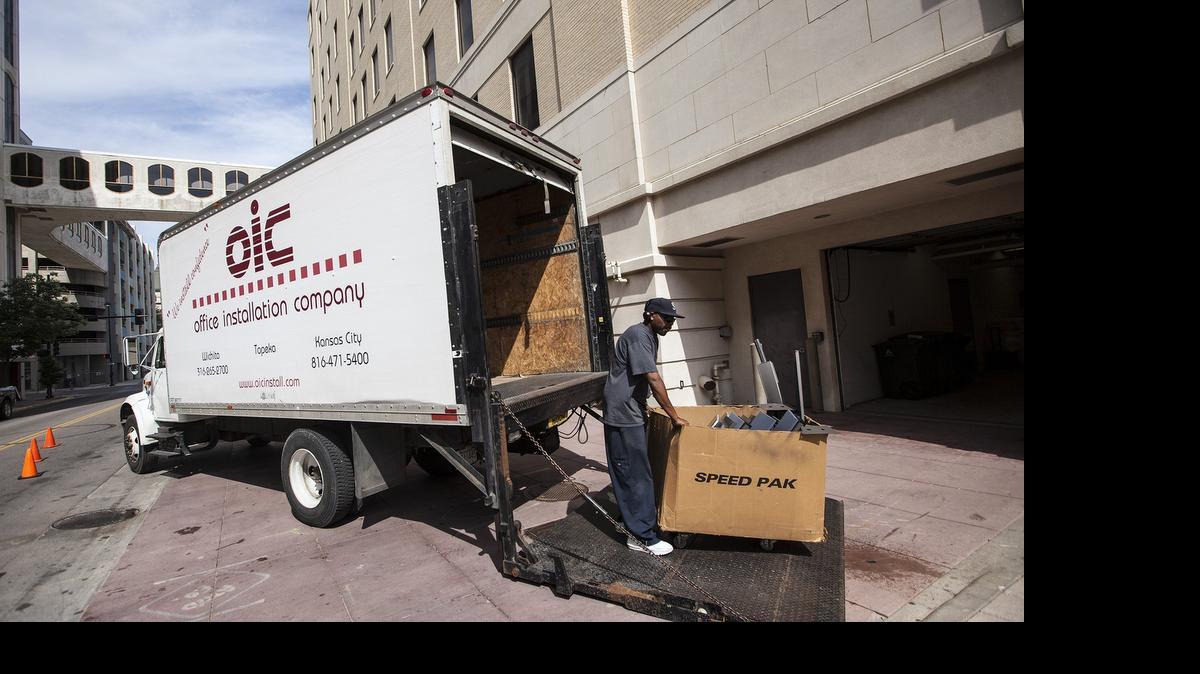 
Workers move the Department of Children and Family Services from the Finney State Office Building. (July 27, 2015)
