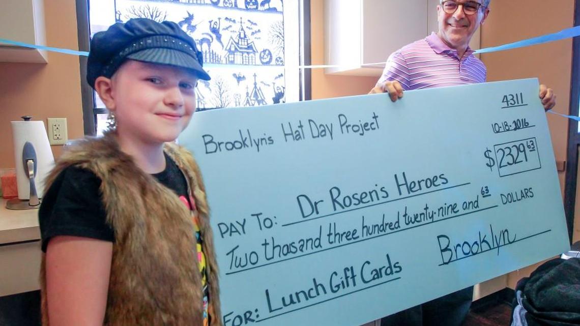 Brooklyn Cowsill, left, a cancer patient who was treated by David Rosen, right, is trying to raise $1,000 in memory of a friend who died of cancer.