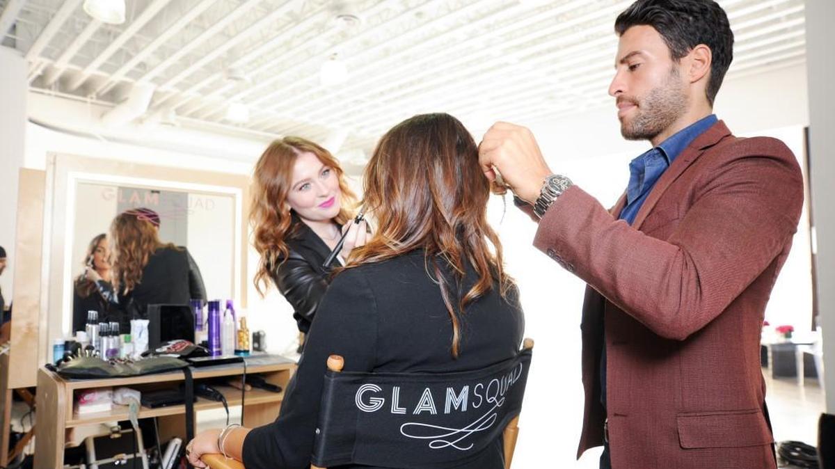 
Kelli Bartlett, left, does makeup while Giovanni Vaccaro does hair. The two are both directors with Glamsquad.
