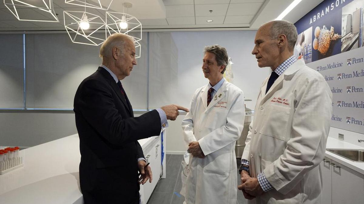 Vice President Joe Biden, left, speaks with doctors Bruce Livine, center, and Carl June on Friday in the Abramson Cancer Center at the University of Pennsylvania in Philadelphia.