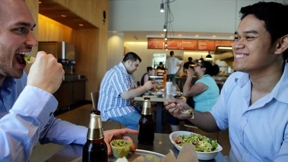 Tom Smurr, left, 24, and Charlie Chan, 27, of Chicago are part of the millennial generation facing uncertain financial futures.