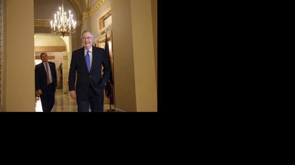 
Assured of becoming the next Senate majority leader after the sweep for the GOP in the midterm elections, current Senate Minority Leader Mitch McConnell of Ky. smiles as he arrives for a meeting of Senate Republicans to choose their leaders for the Congress that convenes in January.
