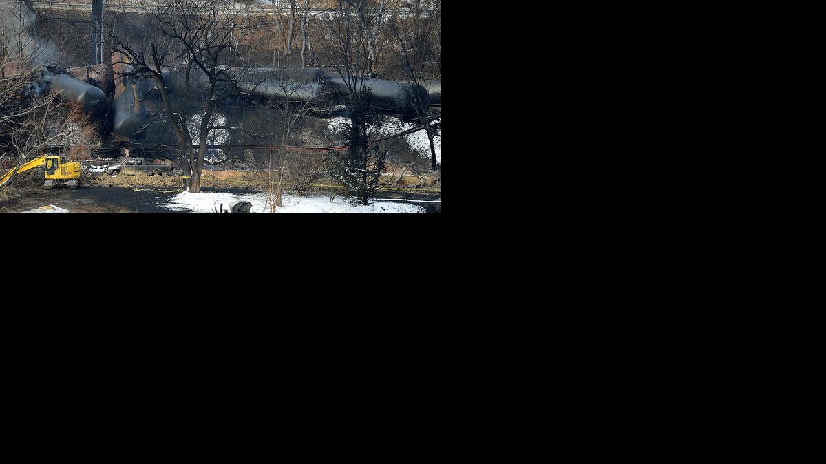 
Heavy equipment works at the scene of a home that was burned down when a train derailment on Monday sent a tanker with crude oil into the Kanawha River, shooting fireballs into the sky near Mount Carbon, W.Va., on Wednesday.
