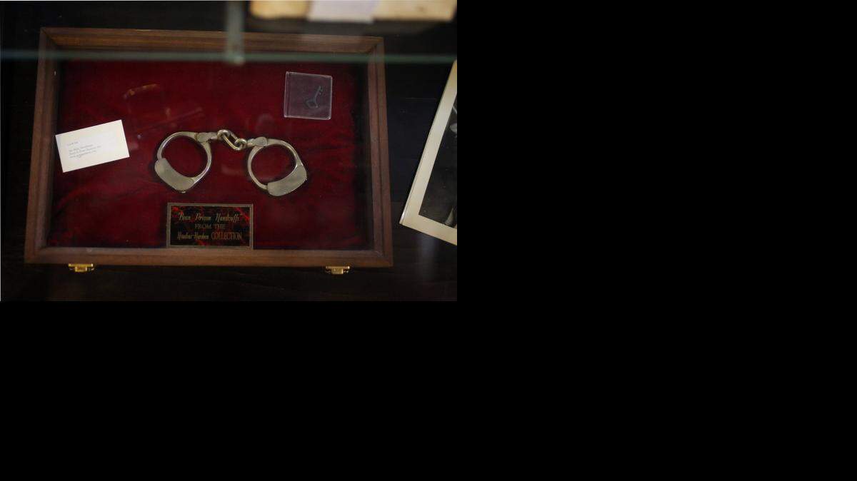 
Handcuffs used by magician Harry Houdini are auctioned off during an auction of Houdini memorabilia at Potter & Potter Auctions last month in Chicago. On this date in 1912, Houdini first publicly performed his “Water Torture Cell” trick at the Circus Busch in Berlin.
