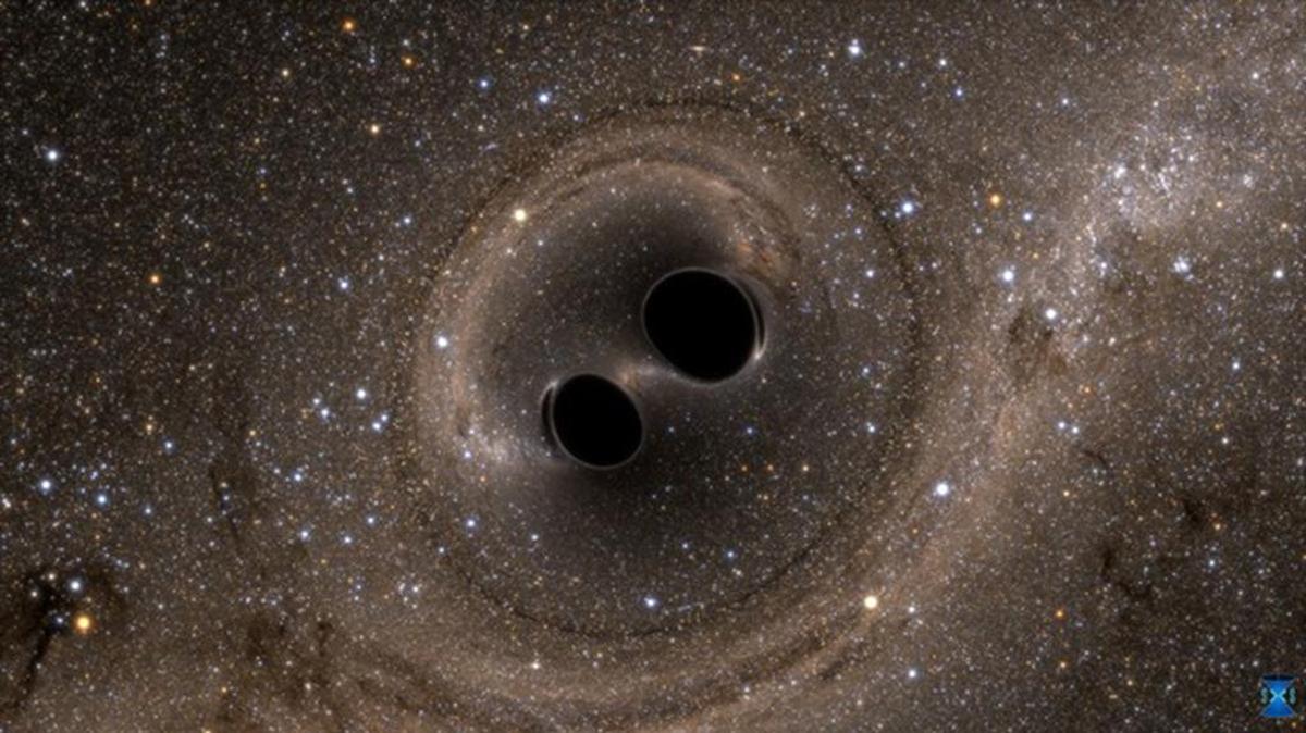 The collision of two black holes — a tremendously powerful event detected for the first time ever by the Laser Interferometer Gravitational-Wave Observatory, or LIGO — is seen in this still from a computer simulation created by the multi-university SXS (Simulating eXtreme Spacetimes) project.