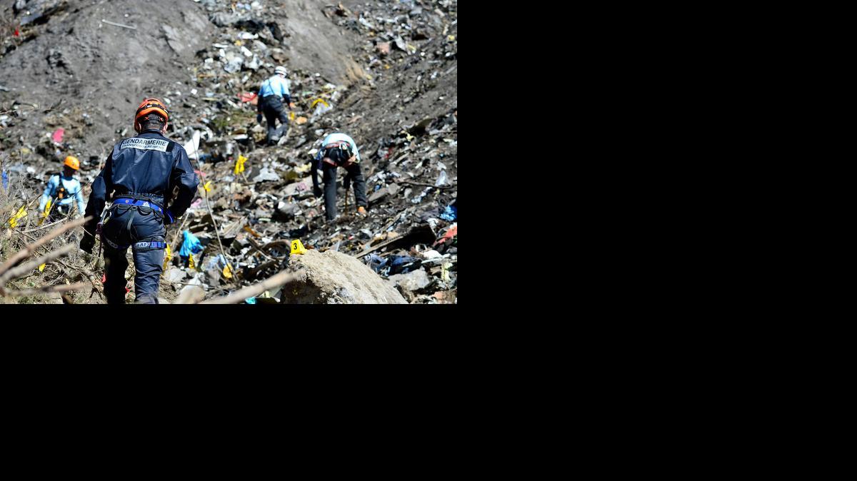 
French emergency rescue services work at the site of the Germanwings jet that crashed on Tuesday near Seyne-les-Alpes, France. The co-pilot of the Germanwings jet barricaded himself in the cockpit and intentionally rammed the plane full speed into the French Alps.
