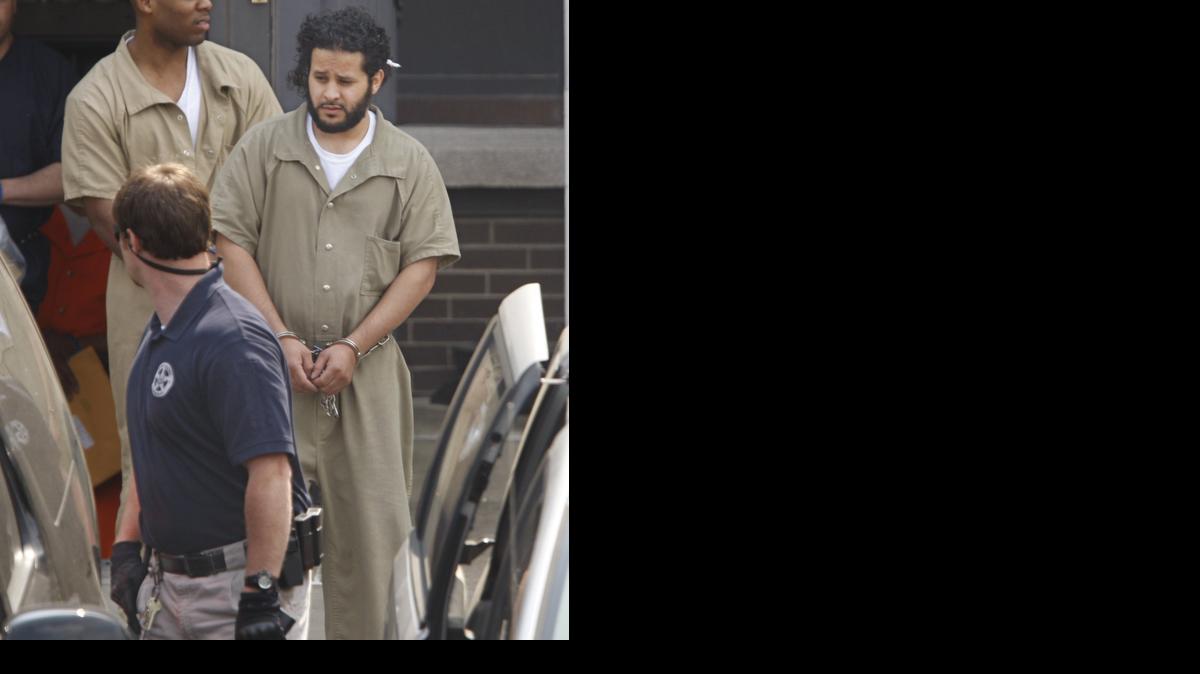 
U.S. marshals lead Mufid A. Elfgeeh, 30, a naturalized U.S. citizen from Yemen, out of federal court in June following a hearing in Rochester, N.Y. Already accused of plotting to kill members of the U.S. military and others, Elfgeeh is now facing new charges that he tried to aid the Islamic State group in Syria and Iraq. Court documents say Elfgeeh encouraged three people to travel to Syria to join fighters with the Islamic State group. 
