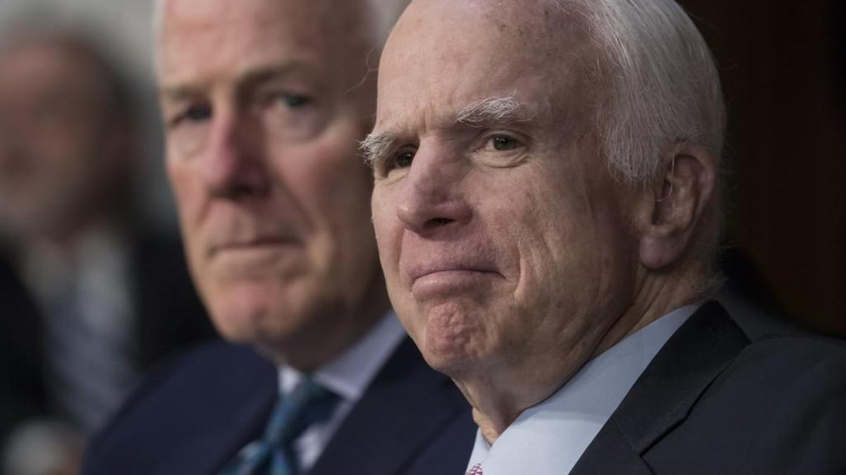 Sen. John McCain, right, R-Ariz., with Sen. John Cornyn, R-Texas, listens as Attorney General Jeff Sessions testifies Tuesday before the Senate Intelligence Committee.