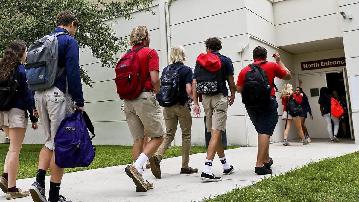 Students make their way to class at Oxbridge Academy of the Palm Beaches. William I. Koch founded the school for academically gifted students of all socioeconomic backgrounds.