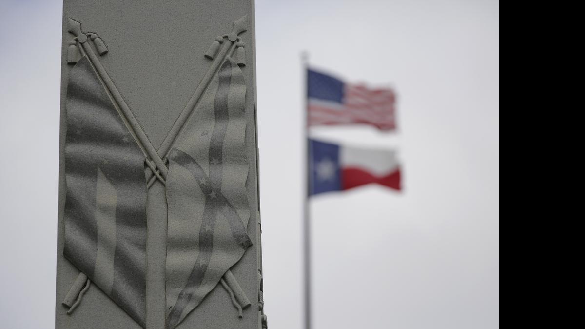 
The Confederate flag is seen on a monument to Hood's Texas Brigade at the Texas State Capitol, Thursday, June 18, 2015, in Austin, Texas. The Supreme Court on Thursday upheld Texas' refusal to issue a license plate bearing the Confederate battle flag, rejecting a free-speech challenge. (AP Photo/Eric Gay) 
