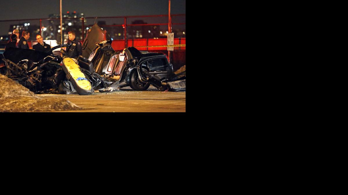 
Officials stand by the scene of a fatal collision that killed longtime “60 Minutes” correspondent Bob Simon, Wednesday, Feb. 11, 2015, in New York. Simon, who was 73, covered riots, Academy Award-nominated movies and wars and was held captive for more than a month in Iraq two decades ago.
