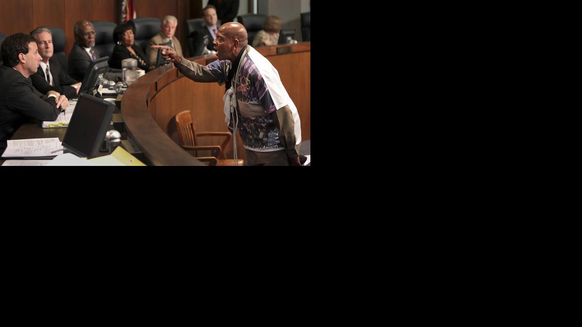 
St. Louis activist Anthony Shahid confronts councilman Steve Stenger during the St. Louis County Council on Tuesday, Sept. 16, 2014, in Clayton, Mo. Protesters seeking the immediate arrest of Ferguson police officer Darren Wilson who fatally shot unarmed 18-year-old Michael Brown disrupted a government meeting Tuesday, renewing calls to remove the county prosecutor investigating the case. 
