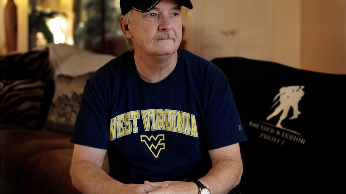 Mike Baughman sits for a photo at his home in Danville, Calif., on Tuesday, Aug. 2, 2016. The 64-year-old is among hundreds of veterans who have been diagnosed with cholangiocarcinoma, a rare form of bile duct cancer that may be linked to their time in the service and an unexpected source: parasites in raw or poorly cooked river fish.