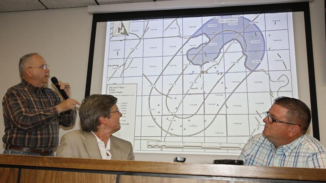 Charles Lord, left, of the Oklahoma Corporation Commission’s earthquake team, speaks during a news conference about recent earthquake activity, as Jeremy Boak, center, director of the Oklahoma Geological Survey, and Jim Marlatt, Oklahoma Corporation Commission’s earthquake team, look on in Oklahoma City on Monday. (Sept. 12, 2016)