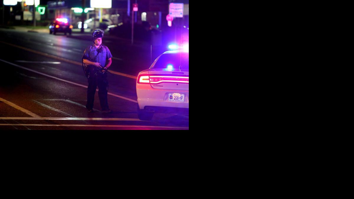 
Police with rifles secure Chambers Road at West Florissant in Ferguson, Mo., on Saturday, Sept. 27, 2014. A Ferguson police officer was shot earlier in the evening. (David Carson/St. Louis Post-Dispatch/MCT) 
