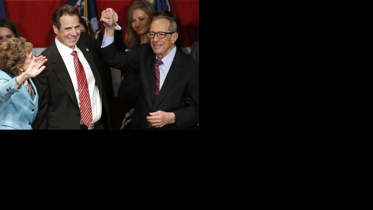 
Democratic New York Gov. Andrew Cuomo, second from left, celebrates with his father, former New York Gov. Mario Cuomo, and his mother, Matilda, left, on Nov. 4, 2014, after defeating Republican challenger Rob Astorino, at Democratic election headquarters in New York. Andrew Cuomo is the first New York Democratic governor since his father to win re-election. Cuomo died Thursday, Jan. 1, 2015, the day his son Andrew started his second term as governor, the New York governor's office confirmed. He was 82.
