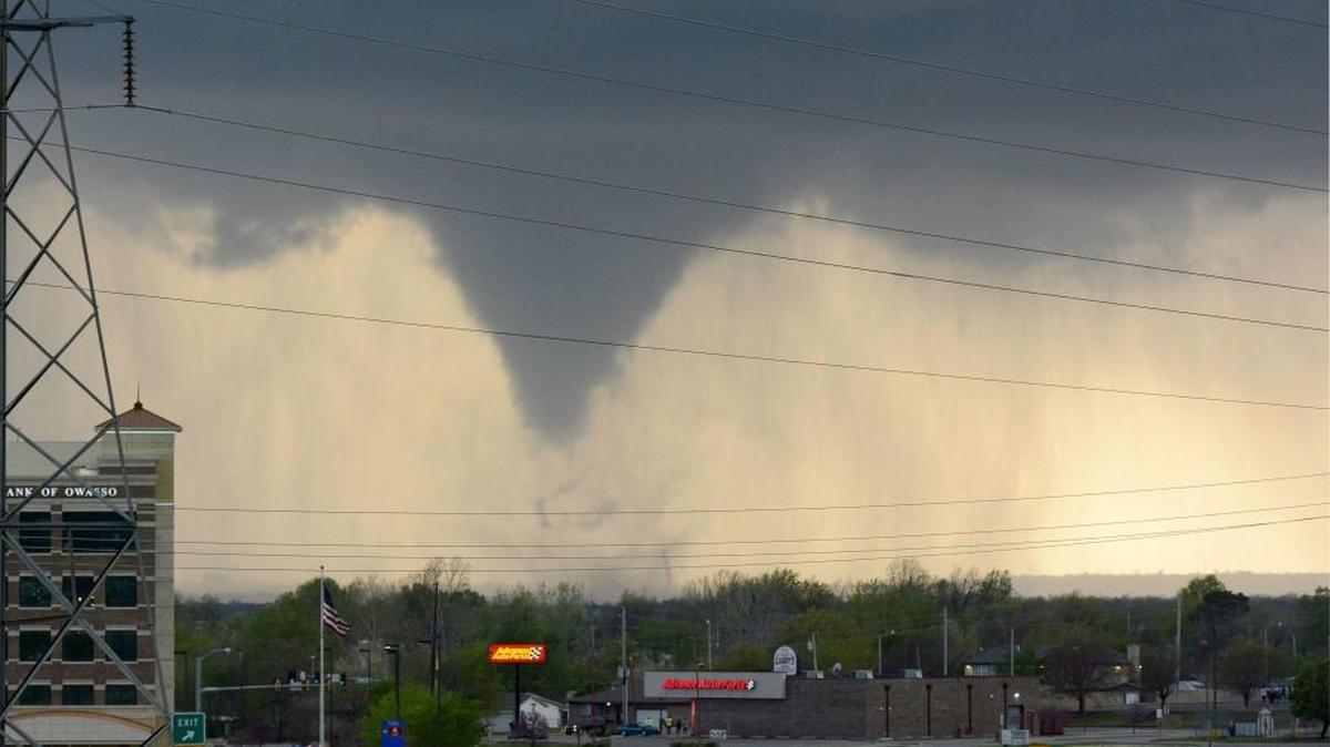 A tornado touches down in Tulsa, Okla., on Wednesday, March 30, 2016. The National Weather Service confirmed multiple tornado touchdowns in the Tulsa area. (AP Photo/Larry Papke)