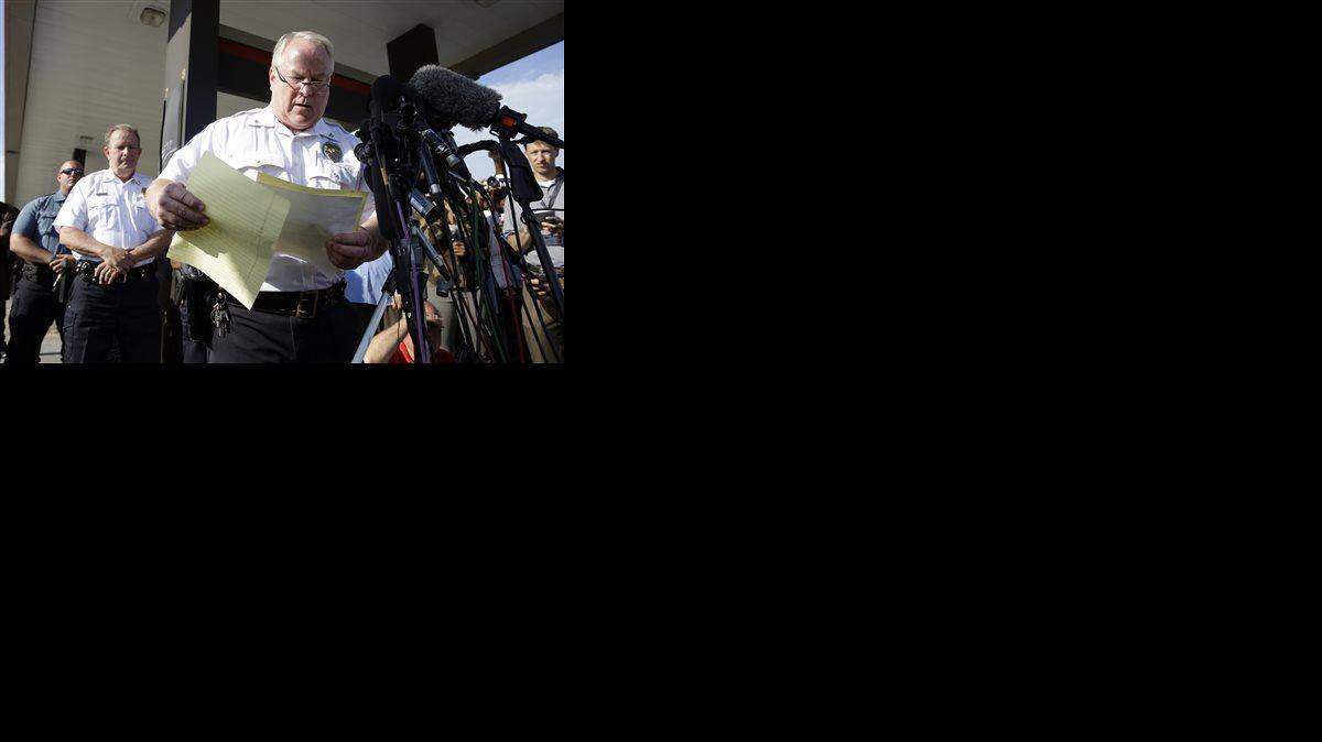 
Ferguson Police Chief Thomas Jackson releases the name of the the officer accused of fatally shooting an unarmed black teenager Friday, Aug. 15, 2014, in Ferguson, Mo. Jackson announced that the officer's name is Darren Wilson. 

