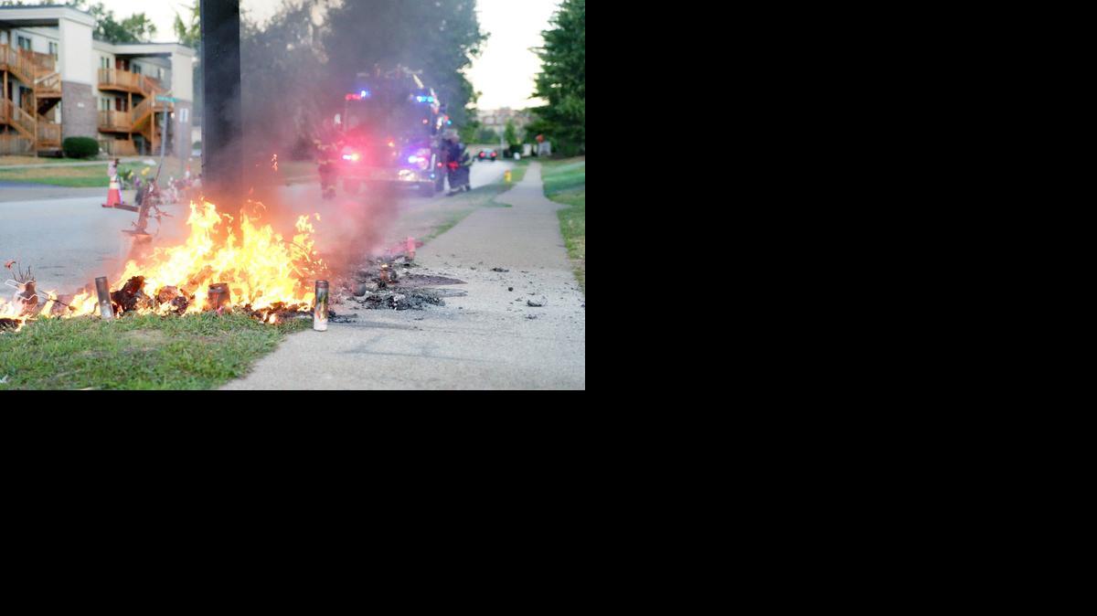 
A fire burns Tuesday at a memorial in Ferguson, Mo., on the site where a Missouri police officer fatally shot 18-year-old Michael Brown. Ferguson Police Chief Tom Jackson says the cause is under investigation.
