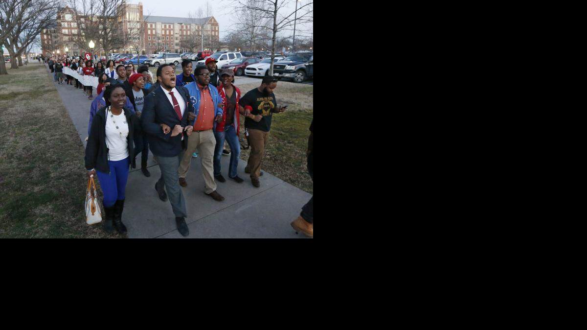 
University of Oklahoma students march to the now closed University of Oklahoma's Sigma Alpha Epsilon fraternity house during a rally in Norman, Okla., Tuesday, March 10, 2015. The university's president expelled two students Tuesday after he said they were identified as leaders of a racist chant captured on video during a fraternity event. (AP Photo/Sue Ogrocki) 
