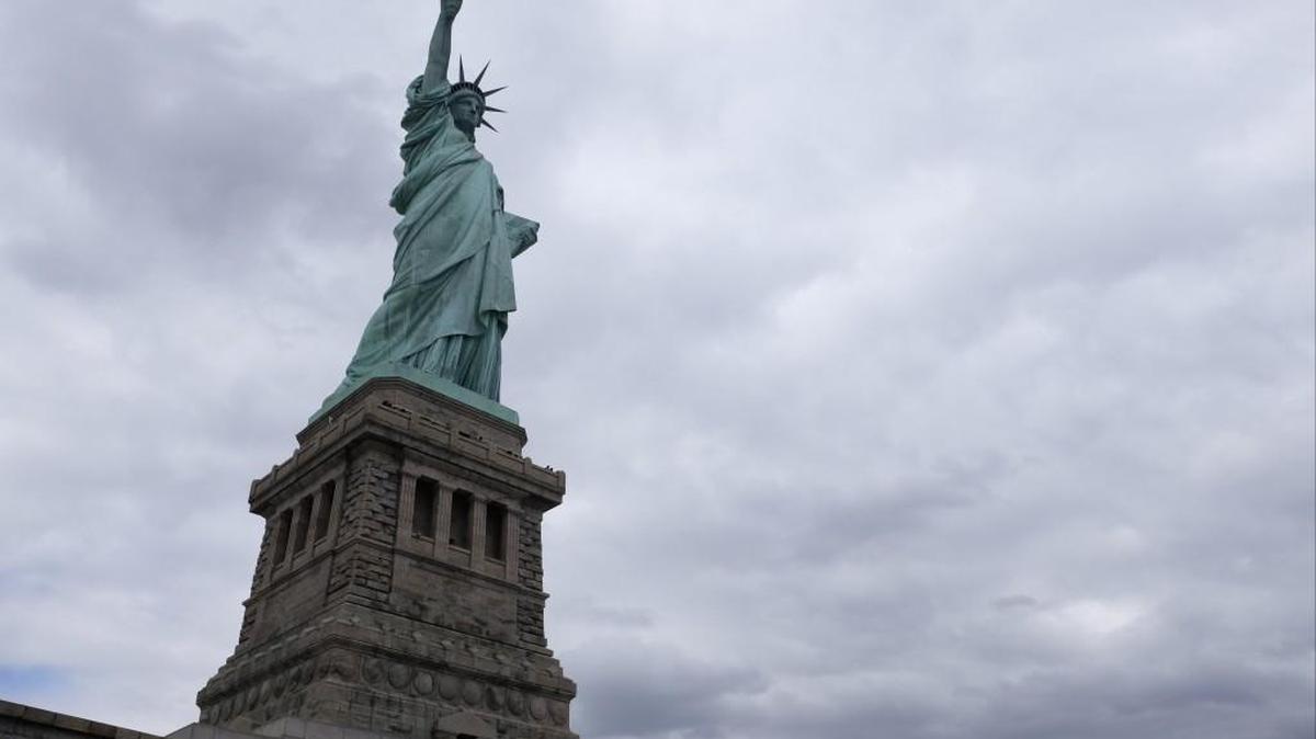 The Statue of Liberty stands on Liberty Island in New York harbor.