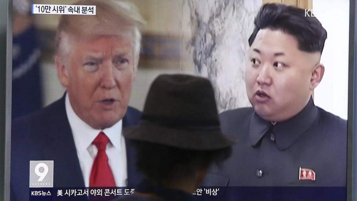 A man watches a television screen showing U.S. President Donald Trump, left, and North Korean leader Kim Jong Un during a news program at the Seoul Train Station in Seoul, South Korea, Thursday.