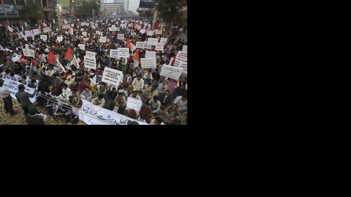 
Supporters of Pakistan's political party Muttahida Qaumi Movement express solidarity with families of the students killed in Tuesday's Taliban attack on a military-run school in Peshawar, as they rally in Karachi, Pakistan, Friday.

