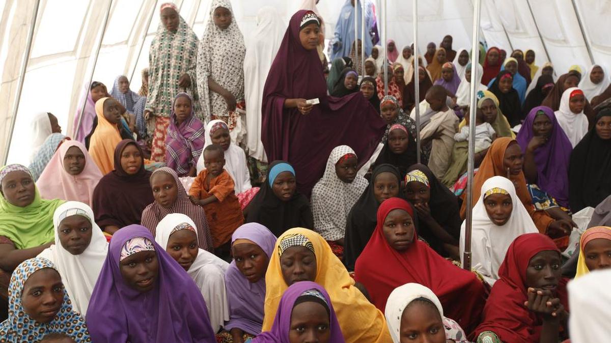Children displaced by Boko Haram in an attack on their villages are lectured in a camp in Maiduguri, Nigeria. Attacks by Boko Haram have forced more than 1 million children out of school.