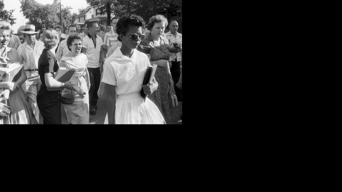 
Hecklers follow Elizabeth Eckford as she walks away from Little Rock’s Central High School on Sept. 4, 1957. Eckford was turned away by Arkansas National Guardsmen, who were instructed by Gov. Orval Faubus not to allow nine black students to enter the school, despite federal court orders. On Sept. 25, 1957, the nine students were escorted back to class by members of the U.S. Army’s 101st Airborne Division.
