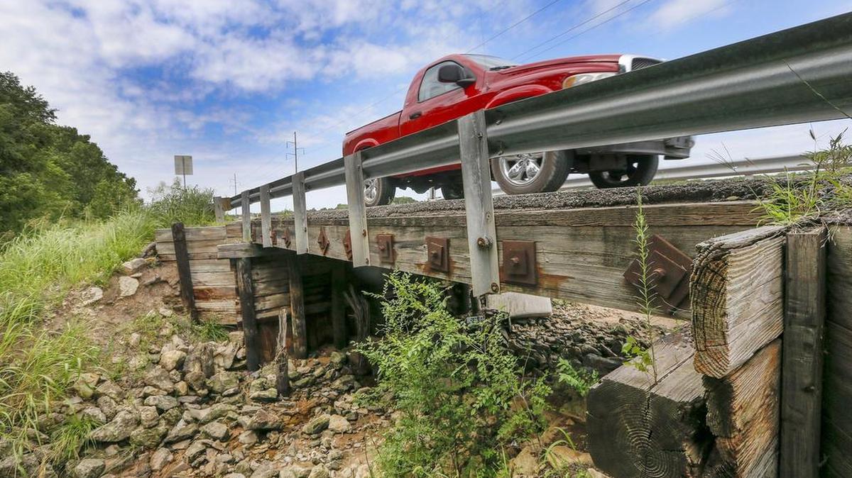 
A truck goes over a small bridge on South Clifton just south of 55th Street on Tuesday afternoon. The recommended county budget calls this bridge “structurally deficient.” (Aug. 4, 2015)
