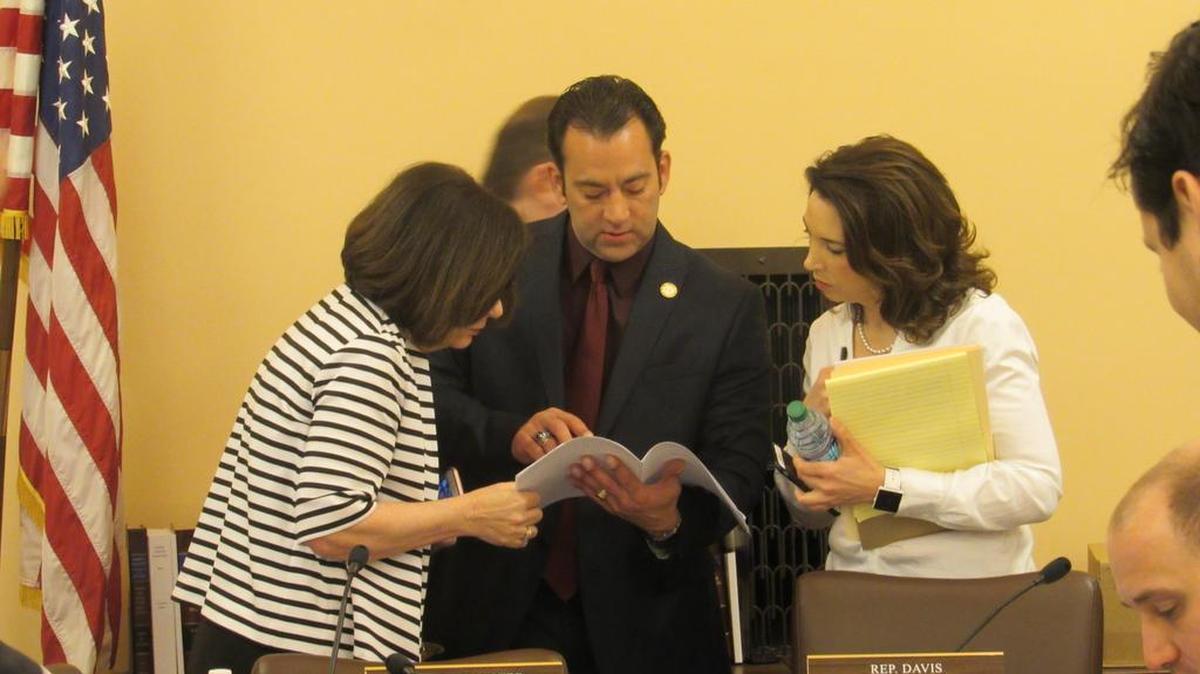 Rep. Kathy Wolfe Moore, left, speaks with Rep. Troy Waymaster and Rep. Erin Davis after a House Appropriations Committee meeting Friday.