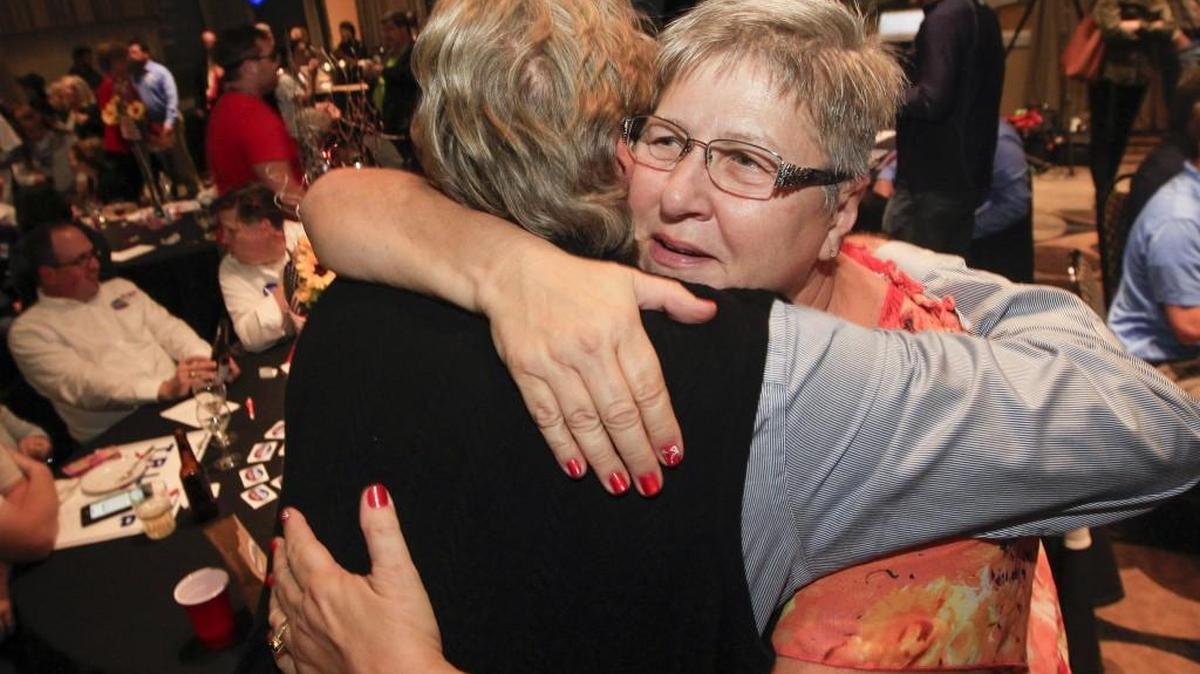 Brenda Landwehr, right, gets a hug from one of her supporters on Election Day. Landwehr is returning to the Legislature after a four-year hiatus. (Nov. 8, 2016)