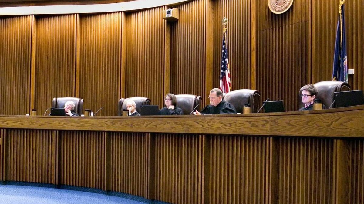 The Kansas Supreme Court reviewed Tuesday whether Kansas lawmakers violated the state constitution when they stripped teachers of a job protection two years ago.