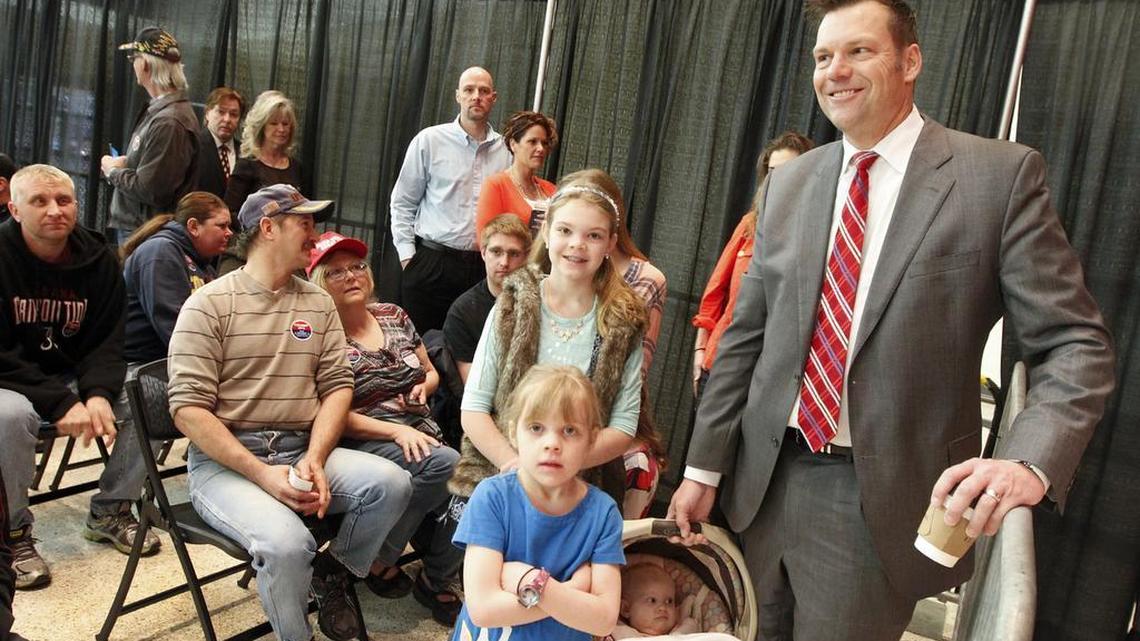 Kansas Secretary of State Kris Kobach and his family arrive at Century II, where the GOP caucus took place in Wichita, Kansas. Kobach addressed the crowd in support of Trump when he took the stage. (March 5, 2016)