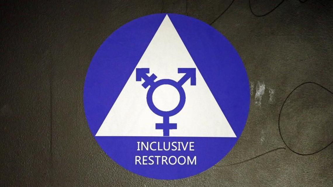 A sticker designates a gender neutral bathroom at a Seattle high school last month. Kansas Attorney General Derek Schmidt’s office announced Wednesday that the state will join a legal challenge to the Obama administration’s directive to local schools on the rights of transgender students.